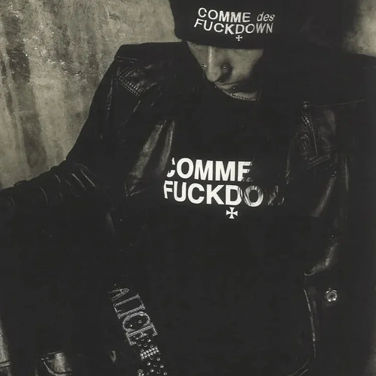 A black Comme des Fuckdown knit hat and a T-shirt.