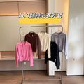 Bright pink Alo Yoga zip-up sweater
