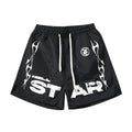 Hellstar Studios black flame-patterned shorts