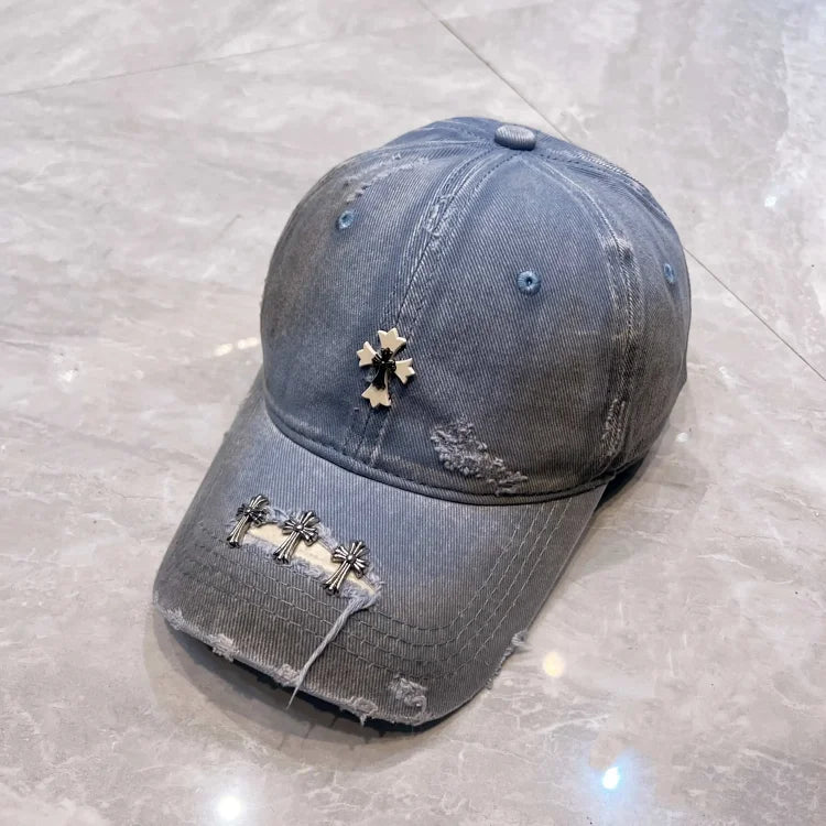 Light blue washed distressed denim baseball cap with silver cross embellishments