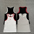 White vest with red piping on the collar and cuffs