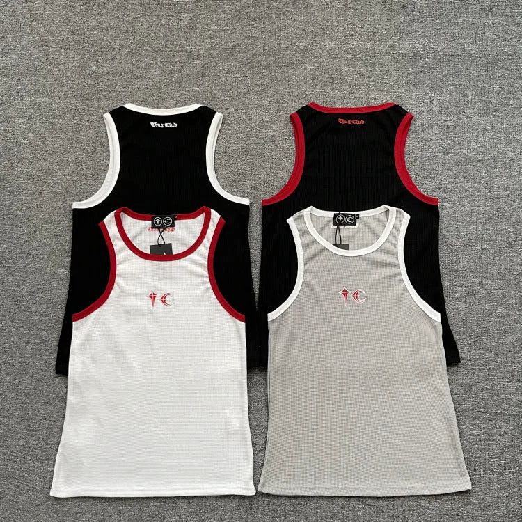 White vest with red piping on the collar and cuffs