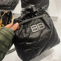 Balenciaga Crush collection black quilted pleated leather chain bag