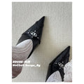 A pair of black Diesel D-Electra stiletto mules